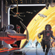 A fleet of Rebel starfighters, and the Millennium Falcon, launch an attack on an Imperial hangar as TIE Pilots and Darth Vader scramble to their own ships.